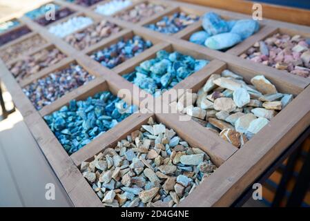 A set of various stones for landscaping, garden paths, flower arrangement. Grey, blue, violet, rusty brown stones. Selective focus. Copy space Stock Photo