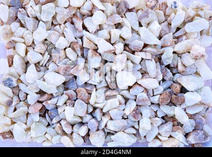 A set of lilac, white and rusty brown stone for landscaping, garden paths, flower arrangement Stock Photo