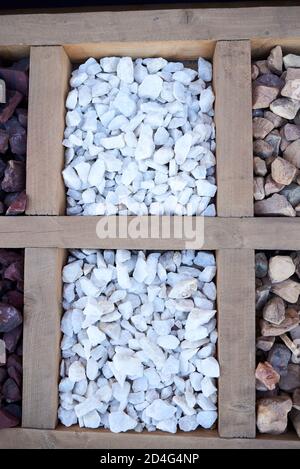 Two sets of bright white stones for landscaping, garden paths, flower arrangement. Top view Stock Photo
