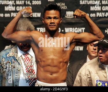 Middleweight boxer Felix 'Tito' Trinidad of Cupey Alto, Puerto Rico poses on the scale during an official weigh-in at the MGM Grand Garden Arena in Las Vegas, Nevada, May 13, 2005. Trinidad (42-1) takes on Winky Wright (48-3) of St. Petersburg, Florida in a 12-round WBC championship elimination bout at the arena May 14. Both fighters weighed the 160 lb. limit. REUTERS/Steve Marcus  SM/HK