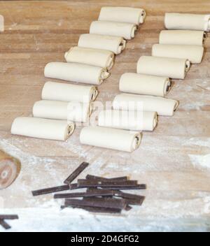 Chocolate croissant before baking in a bakery workshop Stock Photo