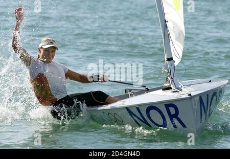 Norway's Siren Sundby sailing in Europe dinghy celebrates winning the gold in the Athens 2004 Olympic Games regatta August 22, 2004. REUTERS/Peter Andrews  PA/DL