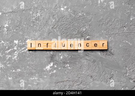 influencer word written on wood block. influencer text on table, concept. Stock Photo