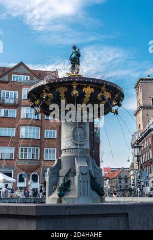 Copenhagen, Denmark - August 27, 2019: The Caritas Well (Caritasbrønden), or the Caritas Fountain (Caritasspringvandet), is the oldest fountain in Cop Stock Photo