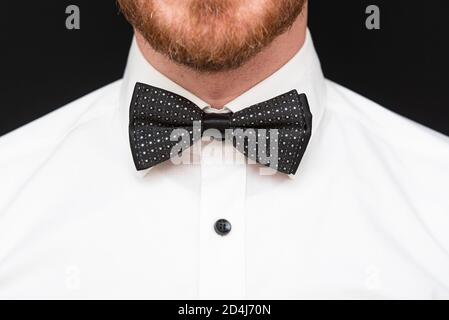 Redhead man with red beard dressed in black bowtie and white shirt Stock Photo