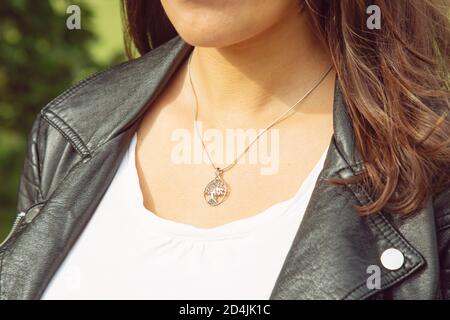 Female neckline wearing tiny silver 