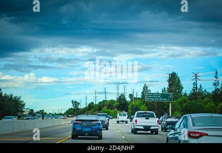 Traffic in a freeway on a cloudy day in California, USA Stock Photo