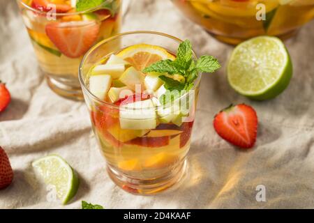 Boozy Refreshing White Wine Sangria with Berries and Apples Stock Photo
