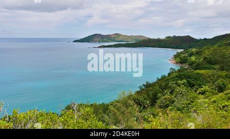 Panoramic view of the northern coast of Praslin island, Seychelles including bay with popular beach Anse Lazio, granite rock formations. Stock Photo