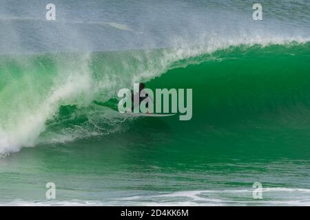 Surfer in a big wave, Anglet in the pays basque, France Stock Photo