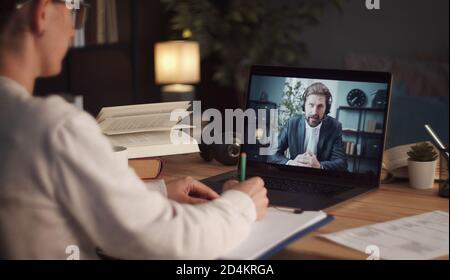 Woman calling online business partner Stock Photo