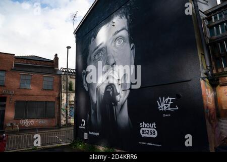 Manchester, UK. 9th October, 2020. A recently completed mural of former Joy Division singer Ian Curtis who died by suicide in 1980 and painted by street artist AkseP19 is seen in central Manchester ahead of  World Mental Health Day, Manchester, UK.  Credit: Jon Super/Alamy Live News. Stock Photo