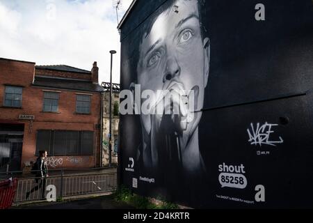 Manchester, UK. 9th October, 2020. A recently completed mural of former Joy Division singer Ian Curtis who died by suicide in 1980 and painted by street artist AkseP19 is seen in central Manchester ahead of  World Mental Health Day, Manchester, UK.  Credit: Jon Super/Alamy Live News. Stock Photo