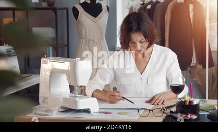 Illustration of a seamstress dressmaker tailor sewing with vintage machine  done in retro woodcut style Stock Vector Image & Art - Alamy