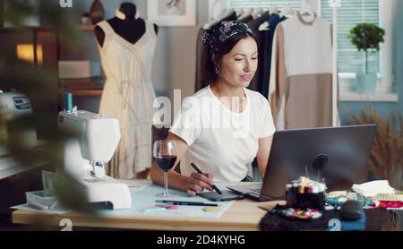 Designer creating sketch using laptop Stock Photo