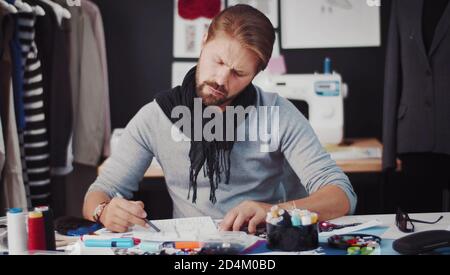 Male fashion designer drawing sketch Stock Photo