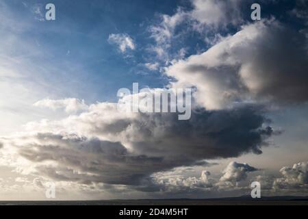 An autumnal image of a weather front over Morecambe bay, stretching from Bolton Le Sands to Walney Island, Lancashire, England. 07 October 2020 Stock Photo