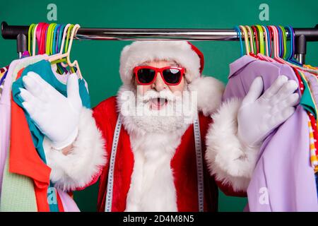 Close-up portrait of his he nice fat funny cheerful cheery Santa father shopper buyer selling season clothes outlet bargain consumerism choose choice Stock Photo