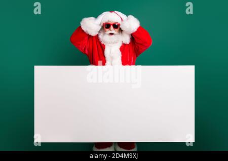 https://l450v.alamy.com/450v/2d4m9xj/photo-of-retired-stylish-grandfather-grey-hair-beard-hands-head-white-empty-placard-offer-crazy-discount-wear-red-santa-x-mas-costume-coat-gloves-2d4m9xj.jpg