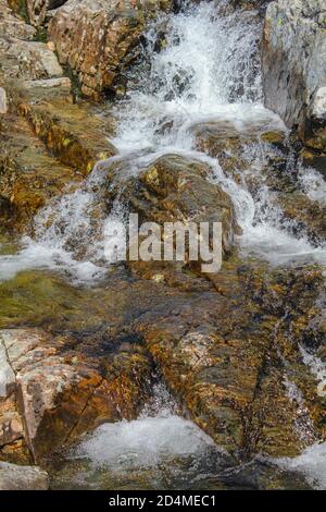 Beautiful Storebottåne river flows into the vavatn lake. Summer landscape in Hemsedal, Norway. Stock Photo