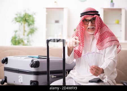 Old arab businessman preparaing for the business trip Stock Photo