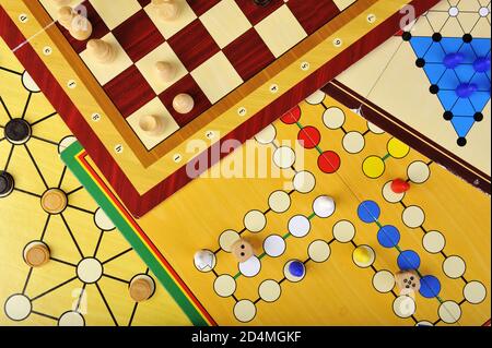 Various board games of ludo, halma, chess and fox and geese Stock Photo