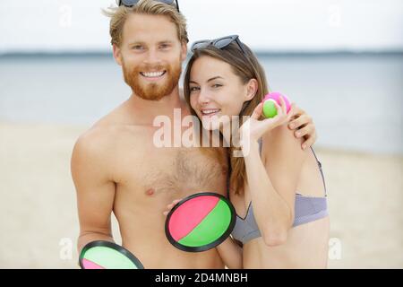 a couple playing beach game Stock Photo