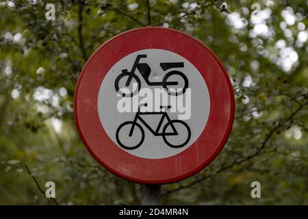 HOGE HEXEL, NETHERLANDS - Oct 02, 2020: Dutch traffic sign on the side of the road depicting a motorcycle and bicycle meaning no entry for those vehic Stock Photo