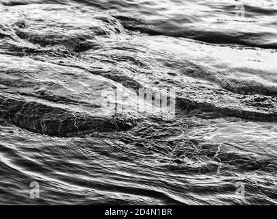 Monochrome ripples in seawater Stock Photo