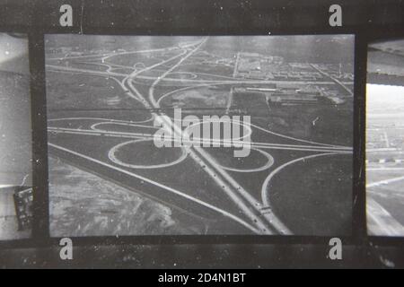 Fine 1970s vintage black and white aerial photography of a cloverleaf highway interchange. Stock Photo