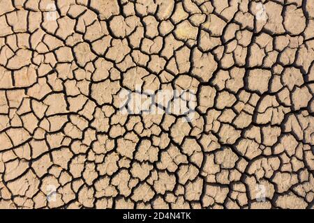 Dry lake bed with cracked Soil, Aerial view. Stock Photo