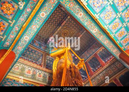 Beijing, China - Jan 12 2020:  Religious statue at Yonghegong Lama  Temple - the Palace of Peace and Harmony Stock Photo