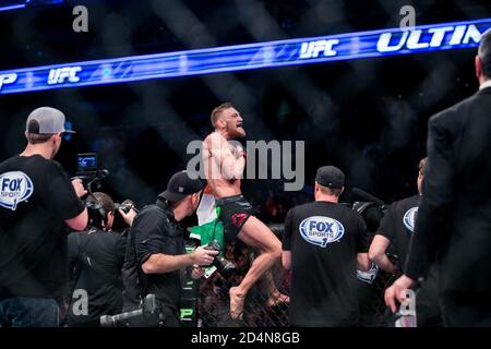 Boston, Massachusetts, USA. 18th Jan, 2015. Featherweight professional mixed martial artist and boxer from Dublin, Ireland CONOR ''NOTORIOUS'' MCGREGOR, 26, (black trunks) celebrates his second-round technical knockout win over Dennis Siver in their main event fight at UFC Fight Night 59 Boston at the TD Garden on Sunday. Credit: Kelvin Ma/ZUMA Wire/Alamy Live News Stock Photo