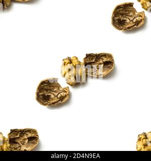 Seamless pattern Of Crushed Walnuts With Nutshell Isolated On White Background Stock Photo