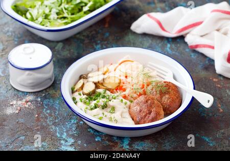 Cutlets with cauliflower and celery root puree, pickled and sauerkraut, selective focus Stock Photo
