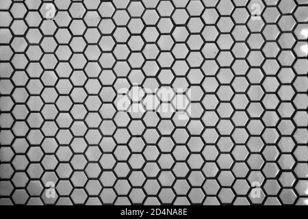 Close up texture and surface of Hexagonal white mosaic floor and wall tiles Stock Photo