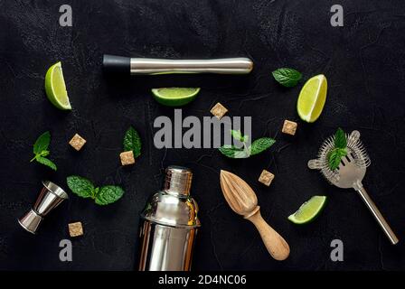 Mojito Cocktail Ingredients and tools on dark table.  Stock Photo