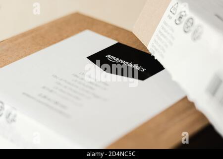 Amazon Essentials label on delivery package Stock Photo
