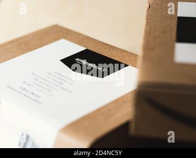 Amazon Essentials label on delivery package Stock Photo