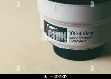 Canon telephoto zoom lens 100-400 millimeter with control switches in close up view. Stock Photo