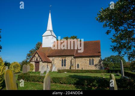 St Mary the Virgin church in Hawkwell, Rochford, near Southend, Essex, UK. Chelmsford diocese. Stone rubble construction. Bright white spire Stock Photo