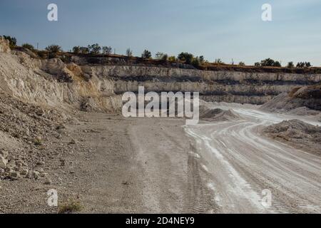 Inside open chalky quarry pit in autumn Stock Photo