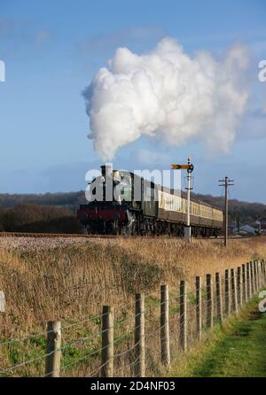 7828 Odney Manor in full flow passing the Up Distant for Blue Anchor and out on to Ker Moor on a Steam Recreations Photo Charter Stock Photo