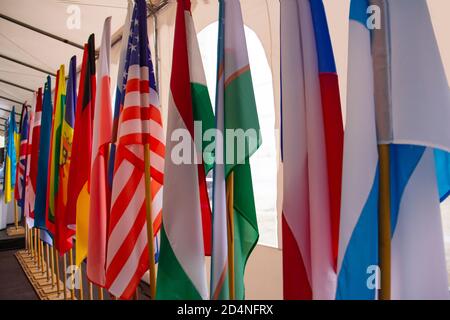 Background from flags of different countries, arranged in a row diagonally. Stock Photo