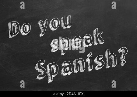 Hand drawing 'Do you speak Spanish?' on blackboard. Stock Photo