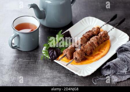 Grilled meat on skewers and eggs keto flat bread, selective focus Stock Photo