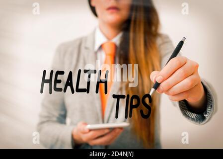 Word writing text Health Tips. Business photo showcasing advice or information given to be helpful in being healthy Model displaying different shots o Stock Photo