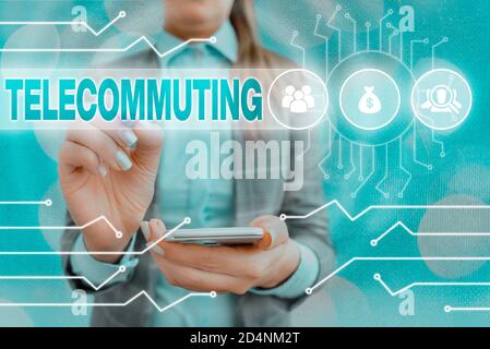 Text sign showing Telecommuting. Business photo text work at home using an electronic linkup with central office System administrator control, gear co Stock Photo