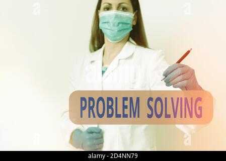 Writing note showing Problem Solving. Business concept for process of finding solutions to difficult or complex issues Laboratory technician featuring Stock Photo