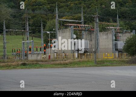 Power transformer station in district town Zarnovica, Slovakia, supplying with electricity the whole region. The station is located in the outskirts. Stock Photo